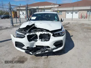 2021 BMW X4 xDrive30i with VIN 5UX2V1C03M9F12611, listed as a IAAI auction lot 42145740 with 60,417 mi miles and . Bid and sale history available at DreamBid. Image 12.