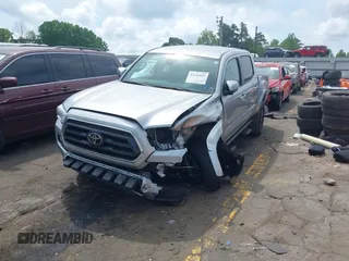 2023 Toyota Tacoma SR with VIN 3TYCZ5AN2PT176554, listed as a IAAI auction lot 42148651 with 15,255 mi miles and . Bid and sale history available at DreamBid. Image 2.