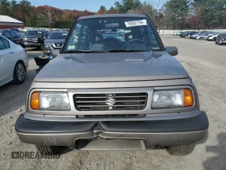 1995 Suzuki Sidekick JX z VIN 2S3TD03V2S6408939, wystawiony jako Copart lot #78862794 z przebiegiem 88 216 mil mil oraz Tytuł czysty. Historia ofert i sprzedaży dostępna na DreamBid. Obrazek 5.