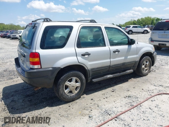 2003 Ford Escape XLS Popular z VIN 1FMYU02183KC05213, wystawiony jako IAAI lot #41955134 z przebiegiem 305 524 mil mil oraz . Historia ofert i sprzedaży dostępna na DreamBid. Obrazek 4.