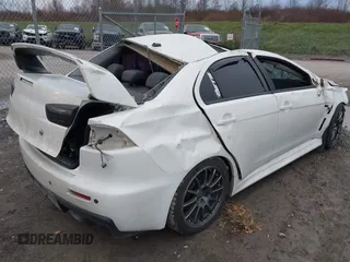 2014 Mitsubishi Lancer Evolution GSR with VIN JA32W8FV5EU012572, listed as a IAAI auction lot 40871463 with 89,529 mi miles. Bid and sale history available at carsss.com. Image 4.