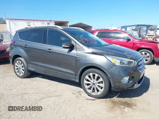 2018 Ford Escape Titanium with VIN 1FMCU0J99JUB09562, listed as a IAAI auction lot 41547659 with 63,700 mi miles and . Bid and sale history available at DreamBid. Image 1.