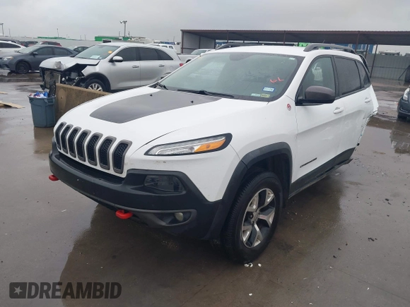 2015 Jeep Cherokee Trailhawk with VIN 1C4PJMBB1FW630519, listed as a IAAI auction lot 41605466 with 219,390 mi miles and . Bid and sale history available at carsss.com. Image 2.