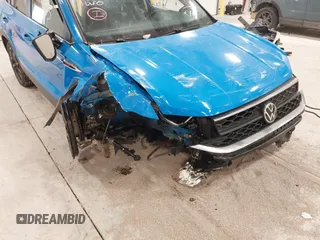 2023 Volkswagen Taos SE z VIN 3VVNX7B24PM301968, wystawiony jako IAAI lot #41155733 z przebiegiem 77 454 mil mil oraz . Historia ofert i sprzedaży dostępna na DreamBid. Obrazek 6.