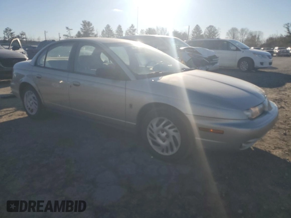 1999 Saturn SL with VIN 1G8ZK5270XZ147170, listed as a Copart auction lot 42169385 with 141,100 mi miles and Clean title. Bid and sale history available at DreamBid. Image 4.