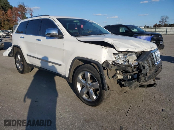 2013 Jeep Grand Cherokee Overland with VIN 1C4RJECG9DC644823, listed as a Copart auction lot 83232414 with 193,205 mi miles and Salvage Title. Bid and sale history available at carsss.com. Image 4.