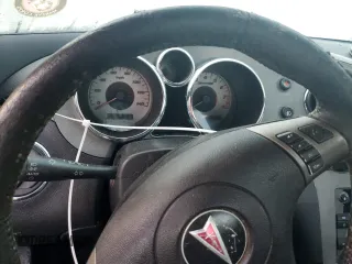 2009 Pontiac Solstice z VIN 1G2MN35B59Y107109, wystawiony jako Copart lot #76083734 z przebiegiem Nie podano mil oraz Nie do naprawy • Non repairable. Historia ofert i sprzedaży dostępna na DreamBid. Obrazek 9.
