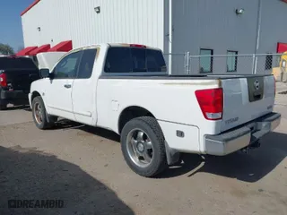 2004 Nissan Titan XE with VIN 1N6AA06A24N512320, listed as a IAAI auction lot 41824825 with 153,225 mi miles. Bid and sale history available at carsss.com. Image 3.