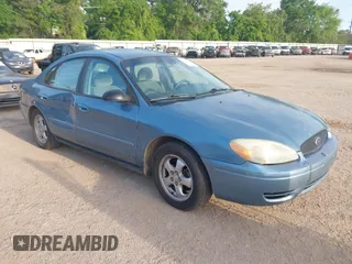 2006 Ford Taurus SE with VIN 1FAFP53U26A179541, listed as a IAAI auction lot 42000612 with 214,881 mi miles. Bid and sale history available at carsss.com. Image 1.