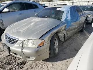 2002 Mazda Millenia z VIN JM1TA221721740136, wystawiony jako Copart lot #45777255 z przebiegiem Nie podano mil oraz Szkoda całkowita • Salvage title. Historia ofert i sprzedaży dostępna na DreamBid. Obrazek 1.