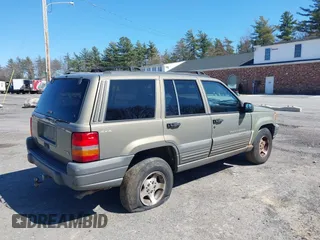 1997 Jeep Grand Cherokee Laredo with VIN 1J4GZ58S7VC713517, listed as a IAAI auction lot 42062214 with 205,533 mi miles. Bid and sale history available at carsss.com. Image 6.