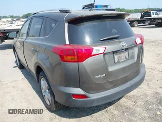 2014 Toyota RAV4 LE with VIN JTMZFREVXED034316, listed as a IAAI auction lot 42610135 with 214,871 mi miles and . Bid and sale history available at DreamBid. Image 3.