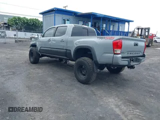 2018 Toyota Tacoma SR5 with VIN 3TMDZ5BN3JM039497, listed as a IAAI auction lot 42326823 with 92,977 mi miles and . Bid and sale history available at DreamBid. Image 3.
