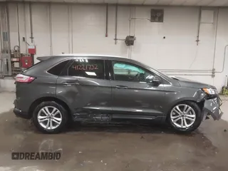 2019 Ford Edge SEL z VIN 2FMPK3J92KBC32443, wystawiony jako IAAI lot #41221732 z przebiegiem 32 307 mil mil oraz . Historia ofert i sprzedaży dostępna na DreamBid. Obrazek 14.