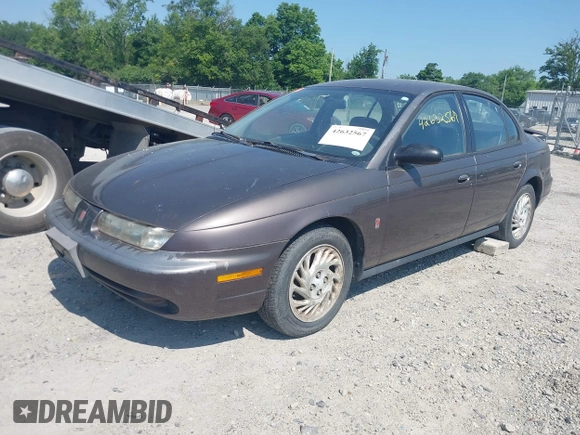 1998 Saturn SL z VIN 1G8ZJ5276WZ291081, wystawiony jako IAAI lot #42632567 z przebiegiem 238 130 mil mil oraz . Historia ofert i sprzedaży dostępna na DreamBid. Obrazek 2.