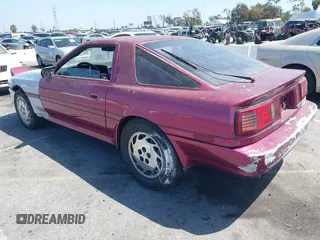 1986 Toyota Supra z VIN JT2MA70J2G0023623, wystawiony jako IAAI lot #42100560 z przebiegiem 182 271 mil mil oraz . Historia ofert i sprzedaży dostępna na DreamBid. Obrazek 3.