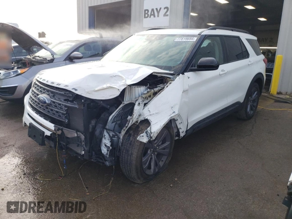 2022 Ford Explorer XLT with VIN 1FMSK8DH9NGC15548, listed as a Copart auction lot 77819694 with 23,087 mi miles and Salvage Title. Bid and sale history available at DreamBid. Image 1.