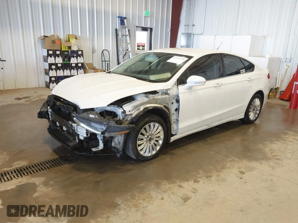 2013 Ford Fusion SE Hybrid with VIN 3FA6P0LU5DR303873, listed as a IAAI auction lot 41074370 with 193,372 mi miles and . Bid and sale history available at DreamBid. Image 2.
