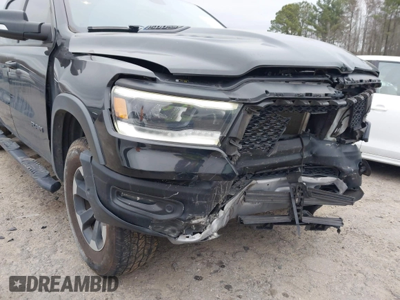2019 Ram 1500 Rebel z VIN 1C6SRFLT1KN722064, wystawiony jako IAAI lot #41513201 z przebiegiem 113 559 mil mil oraz . Historia ofert i sprzedaży dostępna na DreamBid. Obrazek 18.