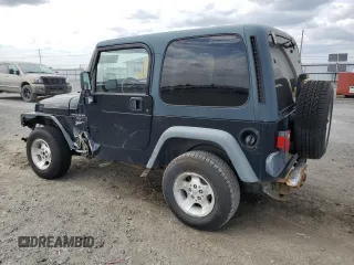 2000 Jeep Wrangler Sport z VIN 1J4FA49S9YP798353, wystawiony jako Copart lot #62009645 z przebiegiem 116 676 mil mil oraz Szkoda całkowita • Salvage title. Historia ofert i sprzedaży dostępna na DreamBid. Obrazek 2.