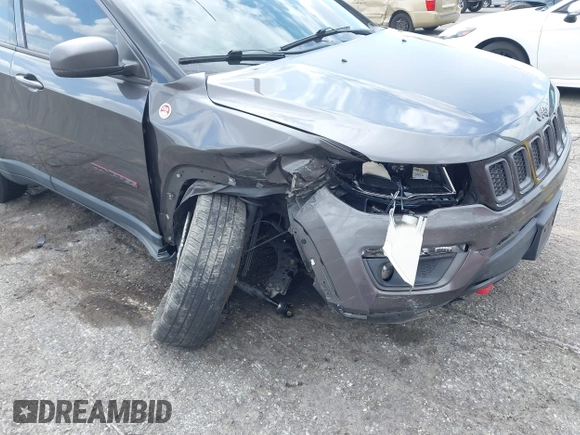 2021 Jeep Compass Trailhawk with VIN 3C4NJDDB6MT561074, listed as a IAAI auction lot 42125886 with 77,293 mi miles and . Bid and sale history available at DreamBid. Image 18.