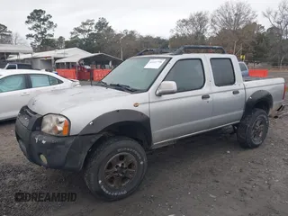 2001 Nissan Frontier SE z VIN 1N6ED27T91C318489, wystawiony jako IAAI lot #41441798 z przebiegiem 214 834 mil mil oraz . Historia ofert i sprzedaży dostępna na DreamBid. Obrazek 6.