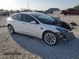 2023 Tesla Model 3 with VIN 5YJ3E1EA4PF631304, listed as a Copart auction lot 52500695 with 33,024 mi miles and Salvage title. Bid and sale history available at DreamBid. Image 4.