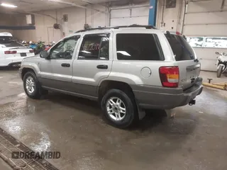 2004 Jeep Grand Cherokee Laredo with VIN 1J4GW48S44C321869, listed as a IAAI auction lot 41822099 with 181,663 mi miles. Bid and sale history available at carsss.com. Image 3.