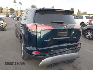 2018 Toyota RAV4 XLE with VIN JTMWFREV2JJ151595, listed as a IAAI auction lot 41380691 with 79,515 mi miles and . Bid and sale history available at carsss.com. Image 3.