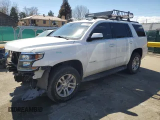 2019 Chevrolet Tahoe LT with VIN 1GNSKBKC5KR137818, listed as a Copart auction lot 50654885 with 138,334 mi miles and Salvage title. Bid and sale history available at DreamBid. Image 1.