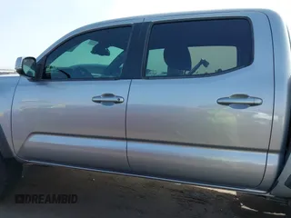 2018 Toyota Tacoma SR5 with VIN 3TMAZ5CN0JM053861, listed as a IAAI auction lot 41920377 with 104,015 mi miles and . Bid and sale history available at DreamBid. Image 14.