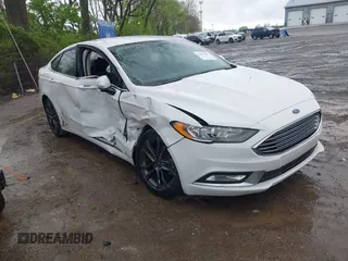 2018 Ford Fusion SE z VIN 3FA6P0LU3JR124906, wystawiony jako IAAI lot #42123517 z przebiegiem 91 736 mil mil oraz . Historia ofert i sprzedaży dostępna na DreamBid. Obrazek 1.
