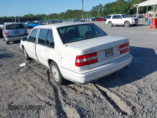 1998 Volvo S90 with VIN YV1KS9605W1129198, listed as a IAAI auction lot 42153215 with 257,242 mi miles. Bid and sale history available at carsss.com. Image 3.