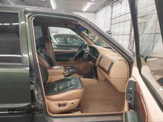 1997 Jeep Grand Cherokee Limited with VIN 1J4GZ78Y0VC684023, listed as a IAAI auction lot 42090436 with 310,831 mi miles. Bid and sale history available at carsss.com. Image 5.