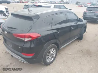 2017 Hyundai Tucson Value with VIN KM8J33A27HU388910, listed as a IAAI auction lot 41101112 with 107,138 mi miles. Bid and sale history available at carsss.com. Image 4.