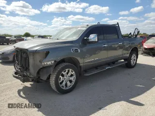 2016 Nissan Titan XD PRO-4X with VIN 1N6BA1F47GN512757, listed as a Copart auction lot 77429314 with 152,756 mi miles and Salvage Title. Bid and sale history available at carsss.com. Image 1.
