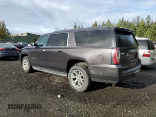 2015 GMC Yukon XL SLT with VIN 1GKS2HKC7FR282543, listed as a Copart auction lot 84996754 with 153,840 mi miles and Clean Title. Bid and sale history available at carsss.com. Image 2.