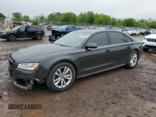 2017 Audi A8 z VIN WAU44AFD0HN004258, wystawiony jako Copart lot #55283985 z przebiegiem 128 059 mil mil oraz Szkody całkowita. Historia ofert i sprzedaży dostępna na DreamBid. Obrazek 1.