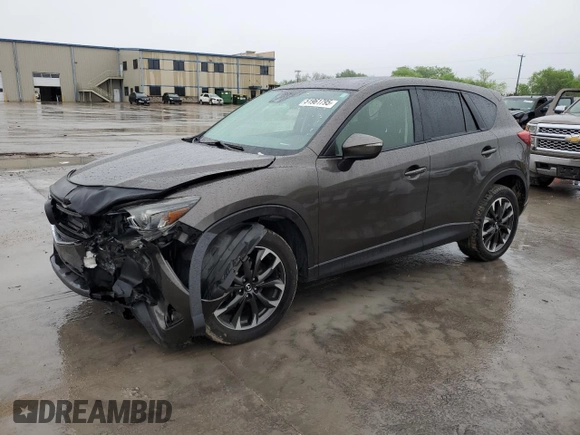 2016 Mazda CX-5 Grand Touring with VIN JM3KE2DY4G0811386, listed as a Copart auction lot 51961795 with 99,525 mi miles and Salvage Title. Bid and sale history available at carsss.com. Image 1.