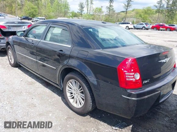 2009 Chrysler 300 Touring with VIN 2C3KA53V99H584082, listed as a IAAI auction lot 42026860 with 147,558 mi miles. Bid and sale history available at carsss.com. Image 3.