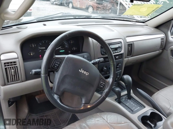 2004 Jeep Grand Cherokee Laredo with VIN 1J4GW48S24C276284, listed as a IAAI auction lot 42596655 with 142,524 mi miles and . Bid and sale history available at DreamBid. Image 14.