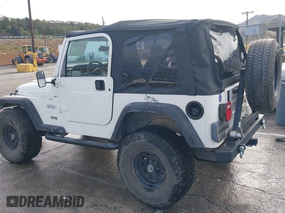 2001 Jeep Wrangler Sport with VIN 1J4FA49S41P308407, listed as a IAAI auction lot 41772240 with 139,461 mi miles. Bid and sale history available at carsss.com. Image 3.