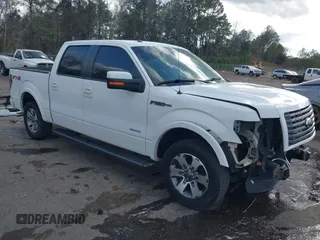 2011 Ford F-150 XLT with VIN 1FTFW1CTXBKE06928, listed as a IAAI auction lot 41718059 with 99,877 mi miles. Bid and sale history available at carsss.com. Image 1.