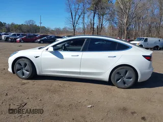 2020 Tesla Model 3 Standard Range Plus with VIN 5YJ3E1EA0LF783672, listed as a IAAI auction lot 41903431 with 52,157 mi miles and . Bid and sale history available at carsss.com. Image 14.