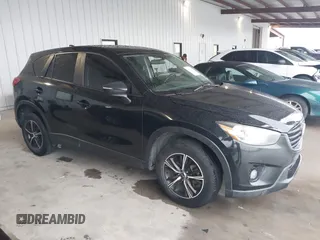 2016 Mazda CX-5 Touring with VIN JM3KE2CY2G0808424, listed as a IAAI auction lot 41880494 with 149,005 mi miles. Bid and sale history available at carsss.com. Image 13.