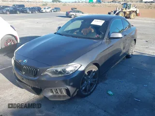2016 BMW 2 Series M235i with VIN WBA1J7C53GV360553, listed as a IAAI auction lot 41561144 with 1 mi miles. Bid and sale history available at carsss.com. Image 2.