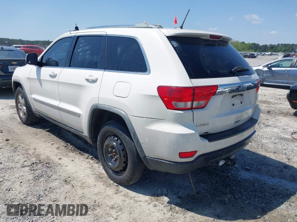 2011 Jeep Grand Cherokee Laredo with VIN 1J4RS4GG5BC573337, listed as a IAAI auction lot 41960369 with 185,518 mi miles and . Bid and sale history available at DreamBid. Image 3.