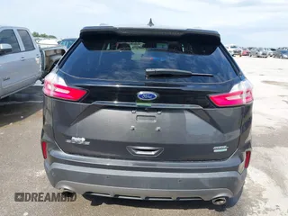 2020 Ford Edge SEL z VIN 2FMPK3J9XLBA54556, wystawiony jako IAAI lot #42179907 z przebiegiem 63 449 mil mil oraz . Historia ofert i sprzedaży dostępna na DreamBid. Obrazek 16.