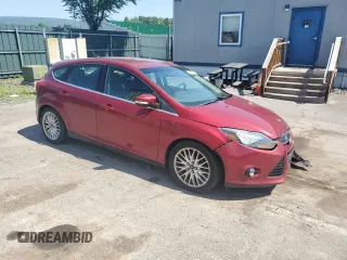 2014 Ford Focus Titanium z VIN 1FADP3N29EL409568, wystawiony jako Copart lot #62295345 z przebiegiem 53 401 mil mil oraz Szkoda całkowita • Salvage title. Historia ofert i sprzedaży dostępna na DreamBid. Obrazek 4.
