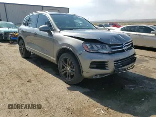 2013 Volkswagen Touareg Sport с VIN WVGEP9BP0DD010408, выставлен на аукционе Copart как лот 75854084 с пробегом 159 863 миль миль и Списание • Salvage title. История ставок и продаж доступна на DreamBid. Изображение 14.